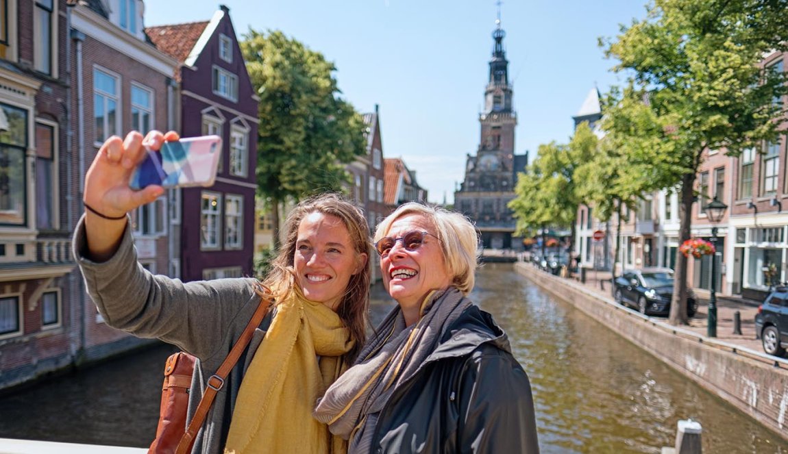 Two women making selfie on bridge in Alkmaar 