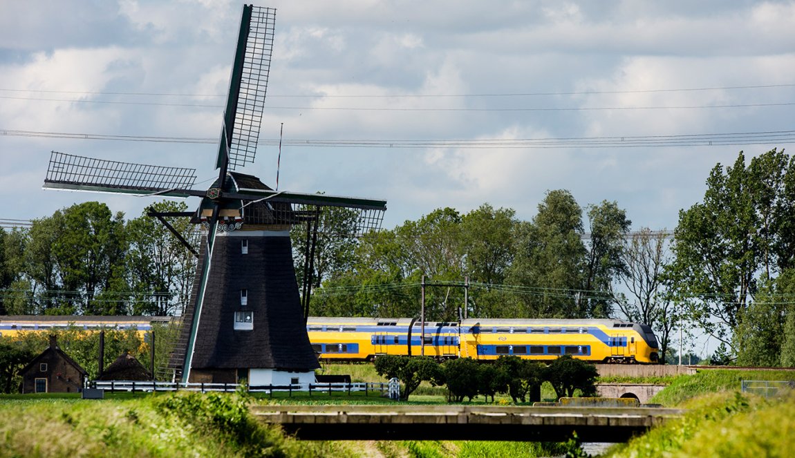 NS train through landscape with mill