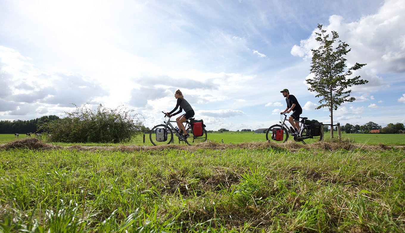 Couple on cycling vacation through the Netherlands