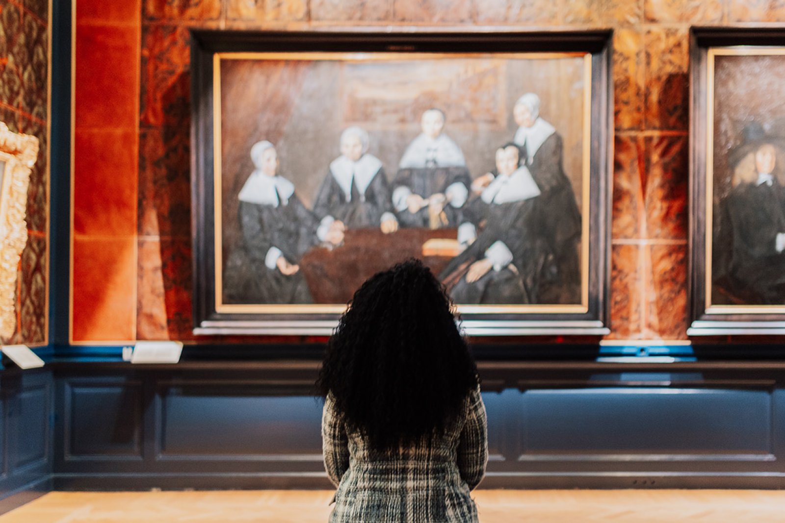 Lady views painting in Frans Hals Museum Haarlem