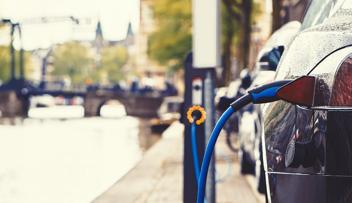 Electric car charging in the street of Amsterdam