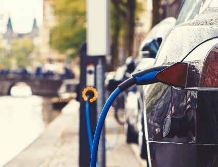 Electric car charging in the street of Amsterdam