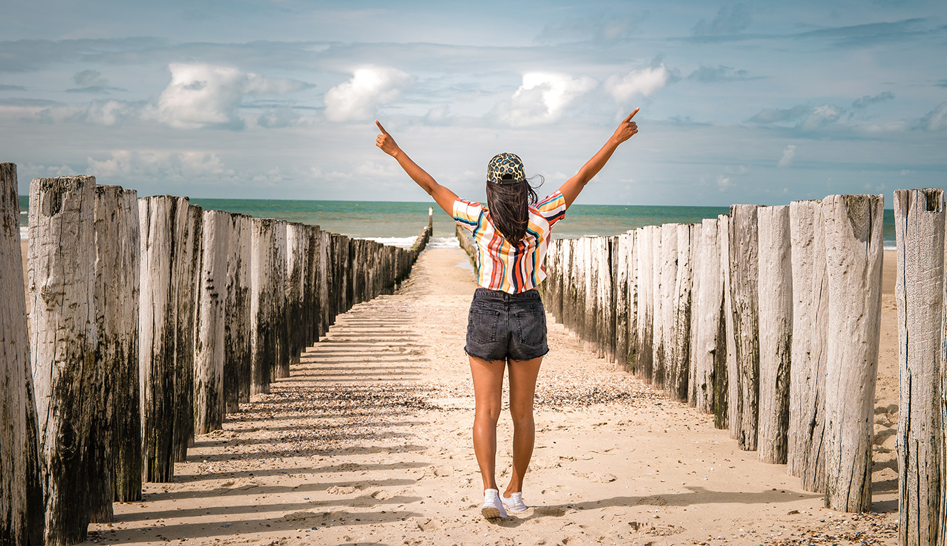 Woman walking beach Domburg Zeeland