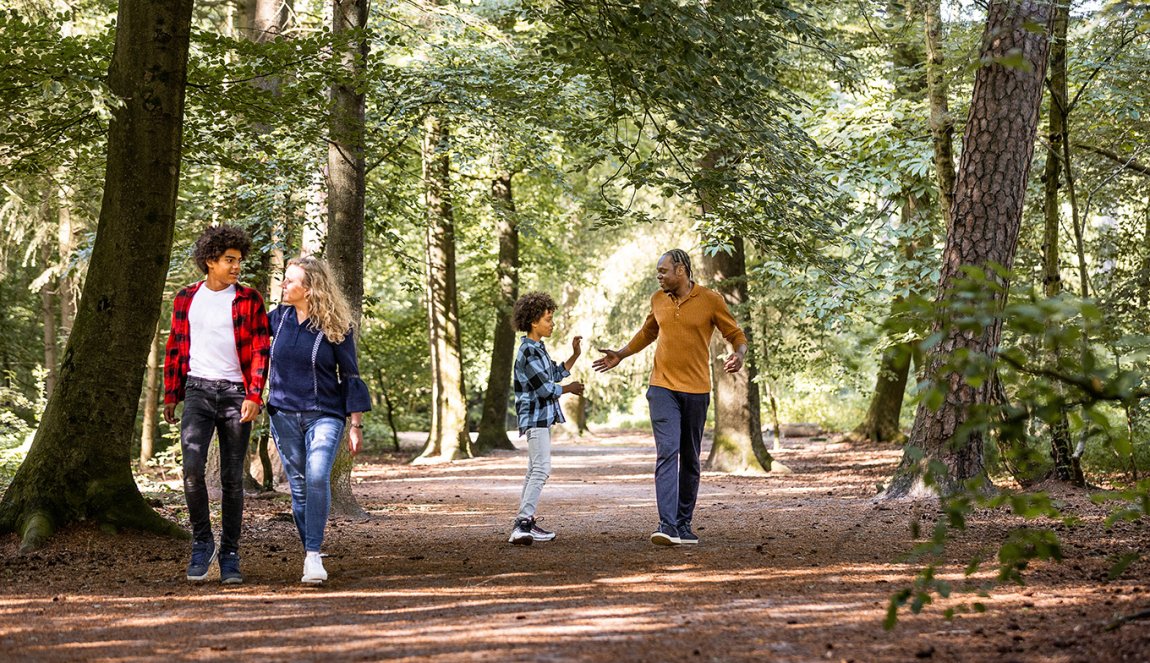 Family walking in Mastbos Breda