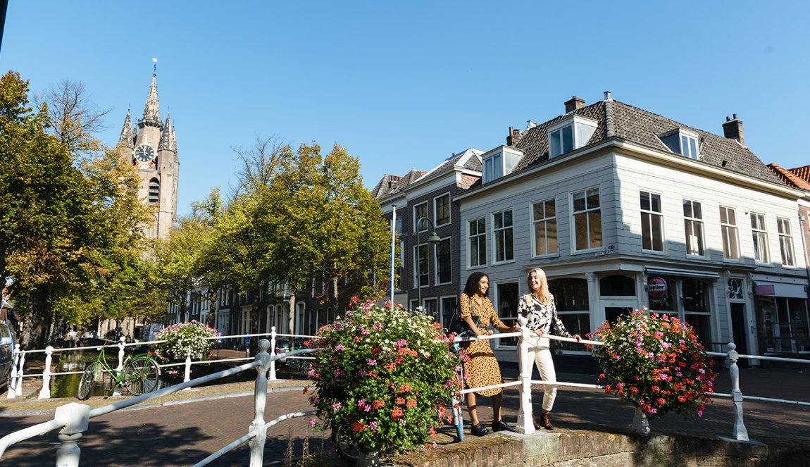 Ladies look out over Delft canal