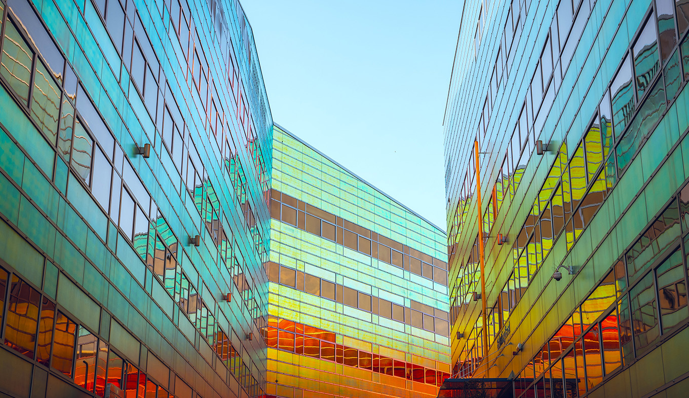 Colorful glass office building in the center of Almere La Defense. Dutch tax office.